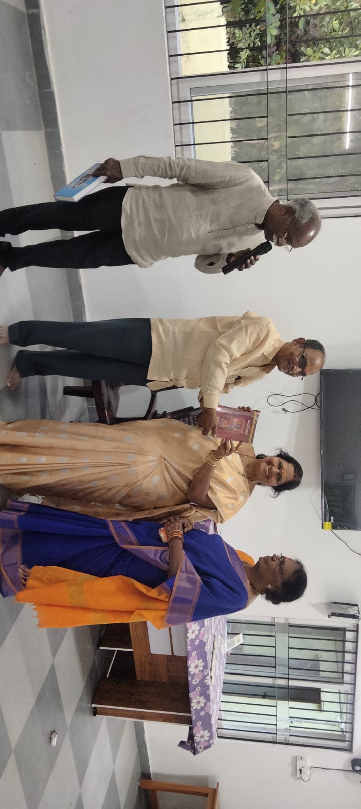 Smt. Radhika Garu receiving prize as Winner in Musical chair game.jpg